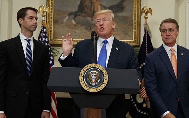President Donald Trump, flanked by Sen. Tom Cotton, R- Ark., left, and Sen. David Perdue, R-Ga., speaks in the Roosevelt Room of the White House in Washington, Wednesday, Aug. 2, 2017, during the unveiling of legislation that would place new limits on legal immigration. (AP/Evan Vucci) President Donald Trump, flanked by Sen. Tom Cotton, R- Ark., left, and Sen. David Perdue, R-Ga., speaks in the Roosevelt Room of the White House in Washington, Wednesday, Aug. 2, 2017, during the unveiling of legislation that would place new limits on legal immigration. (AP/Evan Vucci)