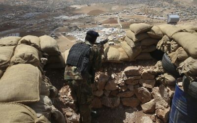 A Lebanese army soldier takes up a position overlooking an area controlled by the Islamic State group at the edge of the town of Arsal, in northeast Lebanon, June 19, 2016. (AP/Hussein Malla) A Lebanese army soldier takes up a position overlooking an area controlled by the Islamic State group at the edge of the town of Arsal, in northeast Lebanon, June 19, 2016. (AP/Hussein Malla)