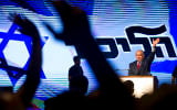 Prime Minister Benjamin Netanyahu speaks to Likud supporters at a rally designed to deliver a powerful show of force as he battles a slew of corruption allegations, August 9, 2017. (AP Photo/Oded Balilty)