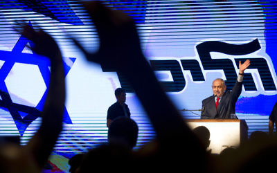 Prime Minister Benjamin Netanyahu speaks to Likud supporters at a rally designed to deliver a powerful show of force as he battles a slew of corruption allegations, August 9, 2017. (AP Photo/Oded Balilty)
