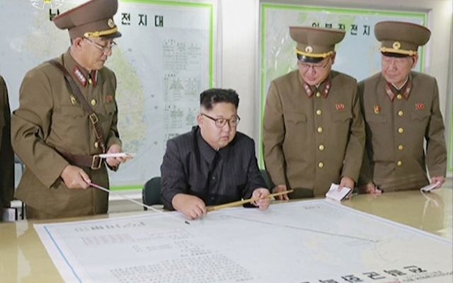 This image made from video of an Aug. 14, 2017, still image broadcast in a news bulletin on August 15, 2017, by North Korea's KRT shows North Korean leader Kim Jong Un receiving a briefing in Pyongyang.(KRT via AP Video) This image made from video of an Aug. 14, 2017, still image broadcast in a news bulletin on August 15, 2017, by North Korea's KRT shows North Korean leader Kim Jong Un receiving a briefing in Pyongyang.(KRT via AP Video)