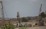 Heavy machinery works on a massive underground barrier that is expected to stretch along the entire 60-kilometer (40-mile) border when it is complete, on the Israeli side of the border with Gaza, September 8, 2016. (AP Photo/Tsafrir Abayov, File)