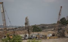 Heavy machinery works on a massive underground barrier that is expected to stretch along the entire 60-kilometer (40-mile) border when it is complete, on the Israeli side of the border with Gaza, September 8, 2016. (AP Photo/Tsafrir Abayov, File)