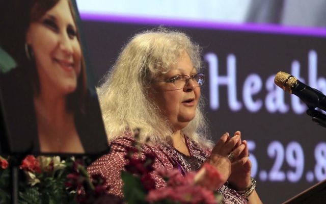 Susan Bro, mother to Heather Heyer, at an memorial for her daughter at the Paramount Theater in Charlottesville, Virginia, August 16, 2017. Heyer was killed on August 12, 2017 when a car rammed into a crowd of people protesting a white nationalist rally.(Andrew Shurtleff/The Daily Progress via AP, Pool) Susan Bro, mother to Heather Heyer, at an memorial for her daughter at the Paramount Theater in Charlottesville, Virginia, August 16, 2017. Heyer was killed on August 12, 2017 when a car rammed into a crowd of people protesting a white nationalist rally.(Andrew Shurtleff/The Daily Progress via AP, Pool)