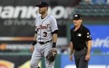 Detroit Tigers second baseman Ian Kinsler (3) stands by second as umpire Angel Hernandez, right, watches play during the second inning of the Tigers' baseball game against the Texas Rangers on Wednesday, Aug. 16, 2017, in Arlington, Texas. (AP/Tony Gutierrez)
