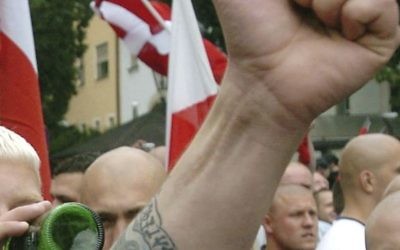 In this file photo dated Saturday, Aug. 21, 2004, Neo-Nazi sympathizers demonstrate prior to the beginning of a commemoration march for Adolf Hitler's deputy Rudolf Hess in the northeastern Bavarian town of Wunsiedel where Hess was buried. (AP Photo/FILE)