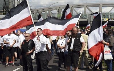 Far-right extremists gather to commemorate the death of Adolf Hitler's deputy, Rudolf Hess, in Berlin's western district of Spandau, Saturday, Aug. 19, 2017. (Maurizio Gambarini/dpa via AP)
