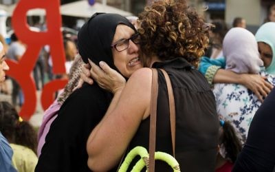 Families of young men believed responsible for the attacks in Barcelona and Cambrils gather along with members of the local Muslim community to denounce terrorism and show their grief in Ripoll, north of Barcelona, Spain on August 19, 2017. (AP Photo/Francisco Seco)