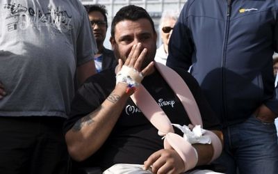 Hassan Zubier wipes his face as he visits Turku Market Square in Turku, Finland, August 20, 2017. (Vesa Moilanen/Lehtikuva via AP)