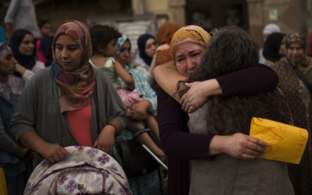 Members of the local Muslim community gather along with relatives of young men believed responsible for the attacks in Barcelona and Cambrils to denounce terrorism and show their grief in Ripoll, north of Barcelona, Spain, Sunday Aug. 20, 2017. (AP Photo/Francisco Seco) Members of the local Muslim community gather along with relatives of young men believed responsible for the attacks in Barcelona and Cambrils to denounce terrorism and show their grief in Ripoll, north of Barcelona, Spain, Sunday Aug. 20, 2017. (AP Photo/Francisco Seco)