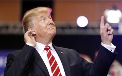 US President Donald Trump reacts to the song as he arrives at a rally at the Phoenix Convention Center, August 22, 2017, in Phoenix. (AP Photo/Alex Brandon)
