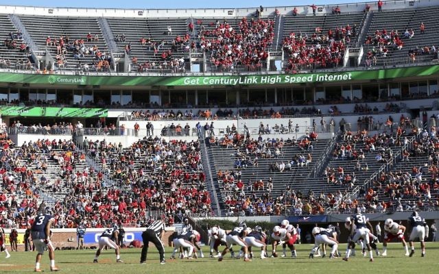 In this Oct. 29, 2016, file photo, Louisville lines up for a play against Virginia during an NCAA college football game in Charlottesville, Virginia. (AP Photo/Ryan M. Kelly, File) In this Oct. 29, 2016, file photo, Louisville lines up for a play against Virginia during an NCAA college football game in Charlottesville, Virginia. (AP Photo/Ryan M. Kelly, File)