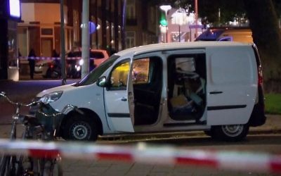 In this image taken from video a van is examined behind a cordoned-off area in Rotterdam on August 23, 2017.  (RTL via AP)