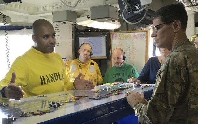 Gen. Joseph Votel, the top US commander for the Middle East, right, gets a briefing on the USS Nimitz, from Lt. Cmdr. Vern Jensen, the aircraft handling officer for the ship, Thursday, Aug. 24, 2017. (AP Photo/Lolita Baldor) Gen. Joseph Votel, the top US commander for the Middle East, right, gets a briefing on the USS Nimitz, from Lt. Cmdr. Vern Jensen, the aircraft handling officer for the ship, Thursday, Aug. 24, 2017. (AP Photo/Lolita Baldor)