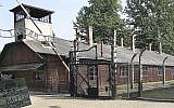 This file photo from July 29, 2016, shows the main gate of the former German Nazi death camp of Auschwitz, Poland. (AP Photo/Czarek Sokolowski)