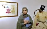 Narges Mousavi, an Iranian artist and daughter of Mir Hossein Mousavi, stands during her exhibition in 'House of Free Designers' art gallery in Tehran, Iran, Friday, Aug. 11, 2017. (Ebrahim Noroozi/AP)