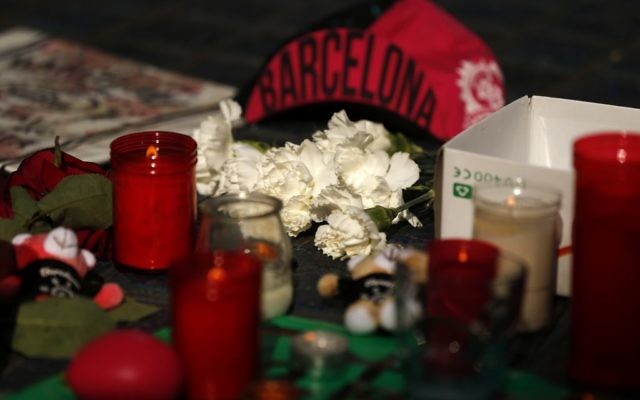 Candles and bunches of flowers placed by people rest on the ground in Las Ramblas, Barcelona, Spain, Friday, Aug. 18, 2017. (Francisco Seco/AP) Candles and bunches of flowers placed by people rest on the ground in Las Ramblas, Barcelona, Spain, Friday, Aug. 18, 2017. (Francisco Seco/AP)
