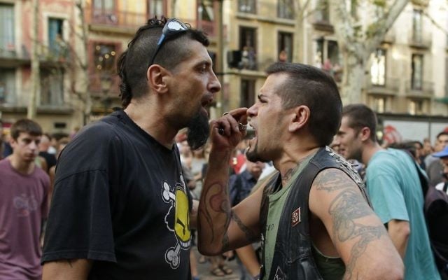 A counter protester and a far-right protester argue during a gathering after a van attack in Barcelona, Spain, Friday Aug. 18, 2017. (AP Photo/Manu Fernandez) A counter protester and a far-right protester argue during a gathering after a van attack in Barcelona, Spain, Friday Aug. 18, 2017. (AP Photo/Manu Fernandez)