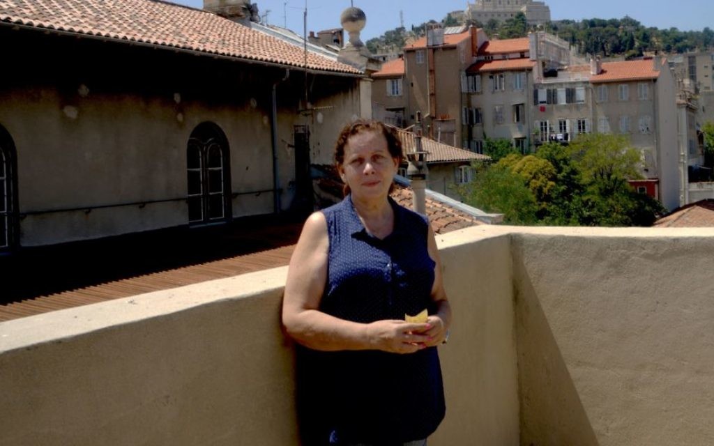Martine Yana, director of the Edmond Fleg Center in Marseille, France, standing on its terrace roof, July 10, 2017. (Cnaan Liphshiz/JTA) Martine Yana, director of the Edmond Fleg Center in Marseille, France, standing on its terrace roof, July 10, 2017. (Cnaan Liphshiz/JTA)