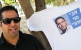 Menny Naftali, the former caretaker at the Prime Minister's Residence, protests outside the Prime Minister's Residence in Jerusalem on July 1, 2015. (Nati Shohat/Flash90)