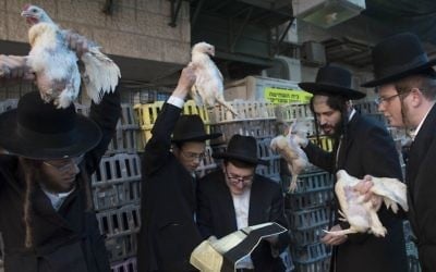 Ultra Orthodox Jews perform the Kaparot ceremony on October 10, 2016, in the ultra-orthodox neighborhood of Mea Shearim in Jerusalem. (Nati Shohat/Flash90)