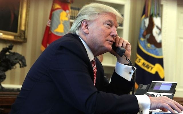 US President Donald Trump speaking on the phone in the Oval Office on June 27, 2017. (Alex Wong/Getty Images) US President Donald Trump speaking on the phone in the Oval Office on June 27, 2017. (Alex Wong/Getty Images)