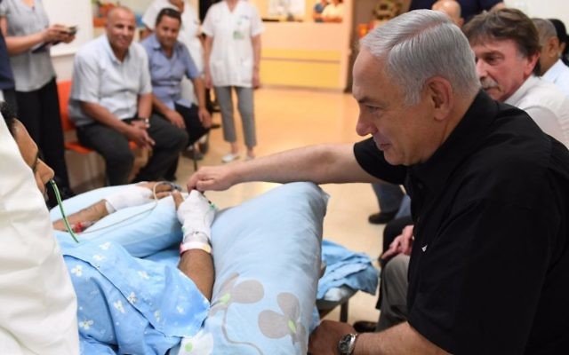Prime Minister Benjamin Netanyahu visits Yavneh stabbing victim Niv Nehemiah in Kaplan Medical Center, August 8, 2017. (Kobi Gideon/GPO) Prime Minister Benjamin Netanyahu visits Yavneh stabbing victim Niv Nehemiah in Kaplan Medical Center, August 8, 2017. (Kobi Gideon/GPO)