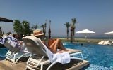 A woman sunbathing at the Setai hotel on the shore of the Sea of Galilee in Israel, August 25, 2017. (Andrew Tobin)