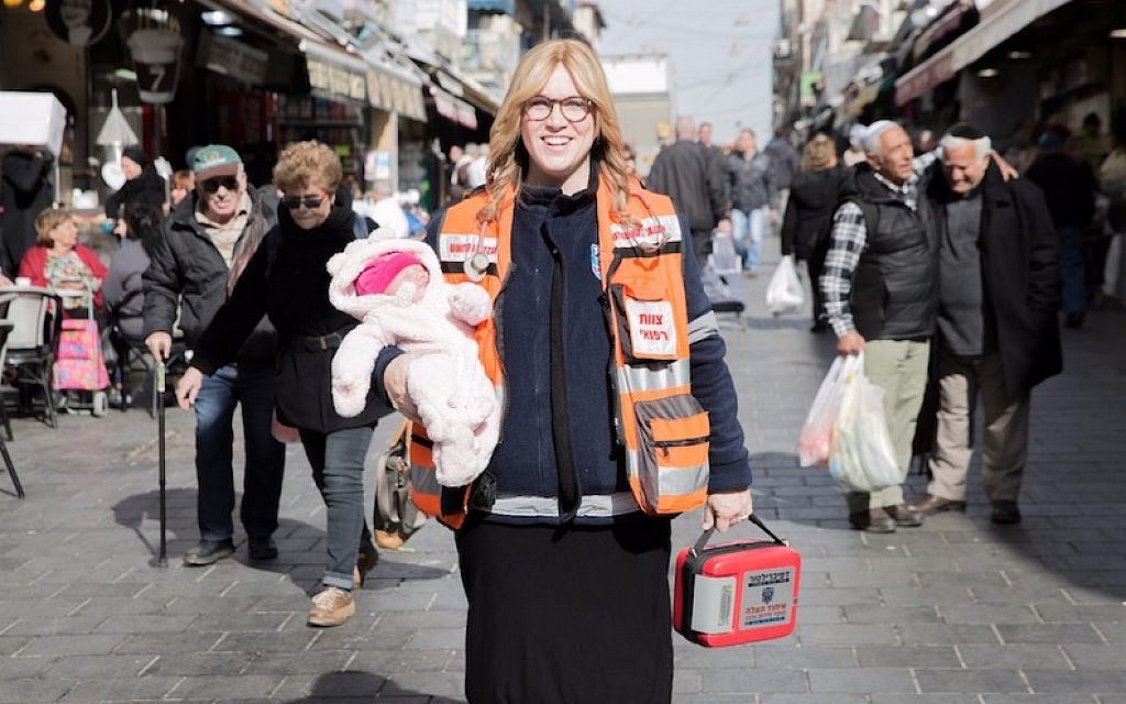 Miriam Ballin, holding her baby daughter, at the Mahane Yehuda market in Jerusalem. (Miriam Ballin via JTA) Miriam Ballin, holding her baby daughter, at the Mahane Yehuda market in Jerusalem. (Miriam Ballin via JTA)
