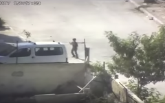 A Palestinian boy uses a slingshot to launch rocks at Israeli troops in the al-Aida refugee camp near Bethlehem on August 6, 2017. (Screen capture: Israel Police)