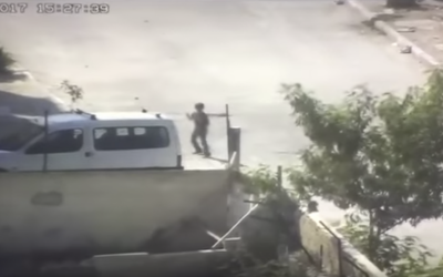 A Palestinian boy uses a slingshot to launch rocks at Israeli troops in the al-Aida refugee camp near Bethlehem on August 6, 2017. (Screen capture: Israel Police) A Palestinian boy uses a slingshot to launch rocks at Israeli troops in the al-Aida refugee camp near Bethlehem on August 6, 2017. (Screen capture: Israel Police)