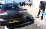 An electric Renault vehicle charges in Ramat Hasharon, Israel. February, 7 2010. (Roni Schutzer/Flash90/Maariv Out)