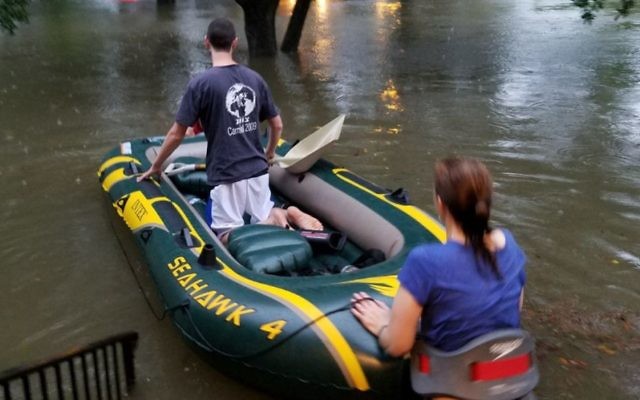 B'nai Akiva emissary Rafi Engelhart sets out with a neighbor who is an EMT to rescue stranded Houstonians from Tropical Storm Harvey, August 27. (Courtesy)