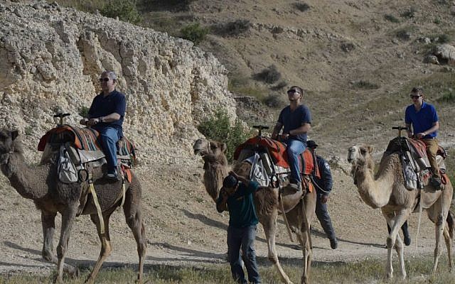 Benjamin Netanyahu, left, rides on a camel with his sons Avner Netanyahu, center, and Yair Netanyahu on April 8, 2015. (Amos Ben Gershom/GPO) Benjamin Netanyahu, left, rides on a camel with his sons Avner Netanyahu, center, and Yair Netanyahu on April 8, 2015. (Amos Ben Gershom/GPO)