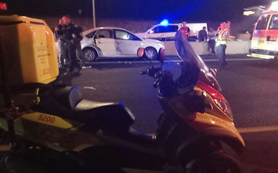 Illustrative: Medics and police at the scene of a car crash, July 2017 (Magen David Adom)