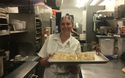 Larissa Raphael showing off her potato-onion knishes in Brooklyn, August 2, 2017. (Josefin Dolsten/JTA)