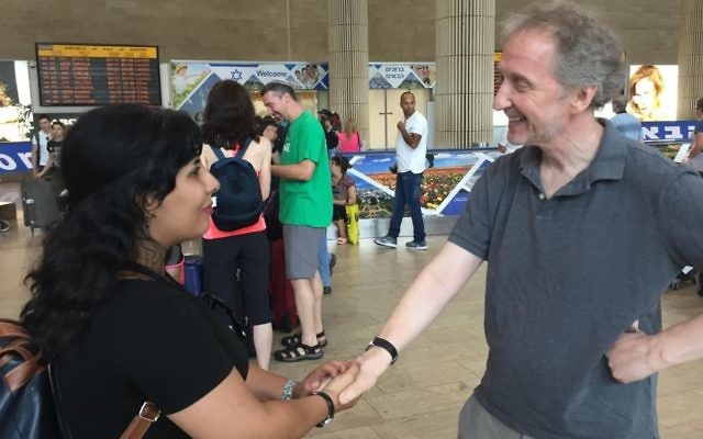 Neda Amin is welcomed by Times of Israel's David Horovitz at Ben-Gurion Airport, August 10, 2017. (Times of Israel staff)