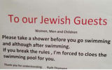 A sign put up at a Swiss hotel calling on Jewish guests to shower before going swimming (Courtesy)