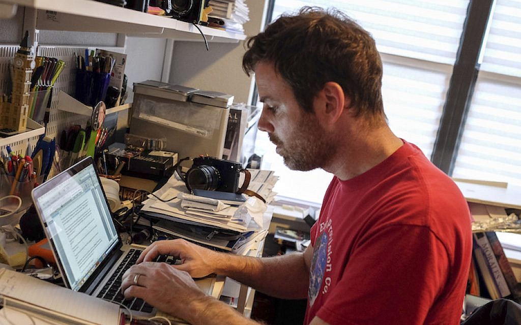 Michael Duke, associate editor of the Houston Jewish Herald-Voice, abandoned his SUV in the flooding but still managed to write his articles. (Courtesy of Duke via JTA) Michael Duke, associate editor of the Houston Jewish Herald-Voice, abandoned his SUV in the flooding but still managed to write his articles. (Courtesy of Duke via JTA)