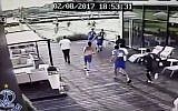 Polish soccer fans descend on two Israelis in Suchocin, about 35 km northwest of Warsaw, following a friendly between Hapoel Petah Tikva and a local Polish club. (screen capture: YouTube)