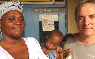 Dr. Omri Emody with a patient and his mother in Ghana (Courtesy).