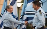 Incoming Israeli Air Force chief Maj. Gen. Amikam Norkin, right, shakes hands with outgoing IAF chief Maj. Gen. Amir Eshel salutes during a ceremony at the Tel Nof Air Base on August 14, 2017. (Israel Defense Forces)