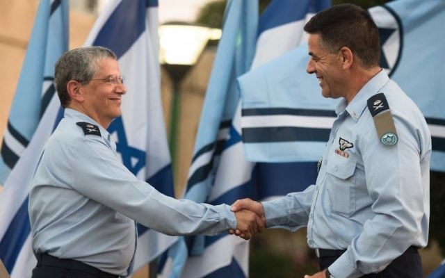 Incoming Israeli Air Force chief Maj. Gen. Amikam Norkin, right, shakes hands with outgoing IAF chief Maj. Gen. Amir Eshel salutes during a ceremony at the Tel Nof Air Base on August 14, 2017. (Israel Defense Forces) Incoming Israeli Air Force chief Maj. Gen. Amikam Norkin, right, shakes hands with outgoing IAF chief Maj. Gen. Amir Eshel salutes during a ceremony at the Tel Nof Air Base on August 14, 2017. (Israel Defense Forces)