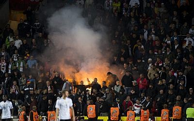 German supporters light flares during the FIFA World Cup 2018 qualification soccer match between Czech Republic and Germany in Prague, Czech Republic, on September 1, 2017. (AFP/Robert Michael)