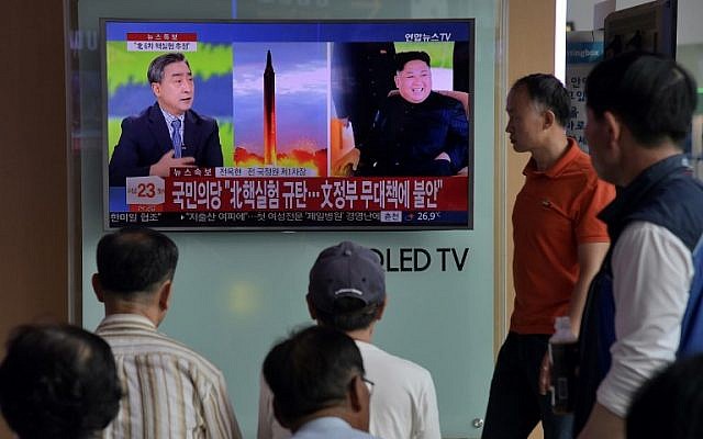 People watch a TV at a train station in Seoul on September 3, 2017, showing a news broadcast about North Korea's latest possible nuclear test. (AFP Photo/Ed Jones) People watch a TV at a train station in Seoul on September 3, 2017, showing a news broadcast about North Korea's latest possible nuclear test. (AFP Photo/Ed Jones)