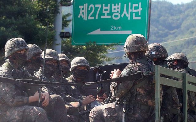 South Korean soldiers ride on a military truck in the border county of Hwacheon on September 4, 2017. (AFP Photo/Yonhap/STR)