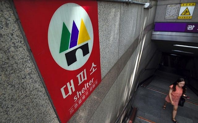 A woman walks past a shelter sign set up on an exit of a subway station in Seoul on September 4, 2017. (AFP PHOTO / JUNG Yeon-Je) A woman walks past a shelter sign set up on an exit of a subway station in Seoul on September 4, 2017. (AFP PHOTO / JUNG Yeon-Je)