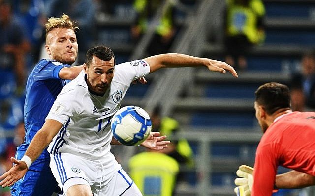 Israel's defender Shir Tzedek (L) vies with Italy's forward Ciro Immobile (R) during the FIFA World Cup 2018 qualification football match between Italy and Israel in Reggio Emilia on September 5, 2017. (AFP PHOTO / Vincenzo PINTO) Israel's defender Shir Tzedek (L) vies with Italy's forward Ciro Immobile (R) during the FIFA World Cup 2018 qualification football match between Italy and Israel in Reggio Emilia on September 5, 2017. (AFP PHOTO / Vincenzo PINTO)