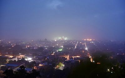 The sunrise is seen through the rain in Cap-Haitien as Hurricane Irma approaches, September 7, 2017. (AFP/Hector RETAMAL)