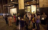 People gather on a street in downtown Mexico City during an earthquake on September 7, 2017. (AFP PHOTO / PEDRO PARDO)